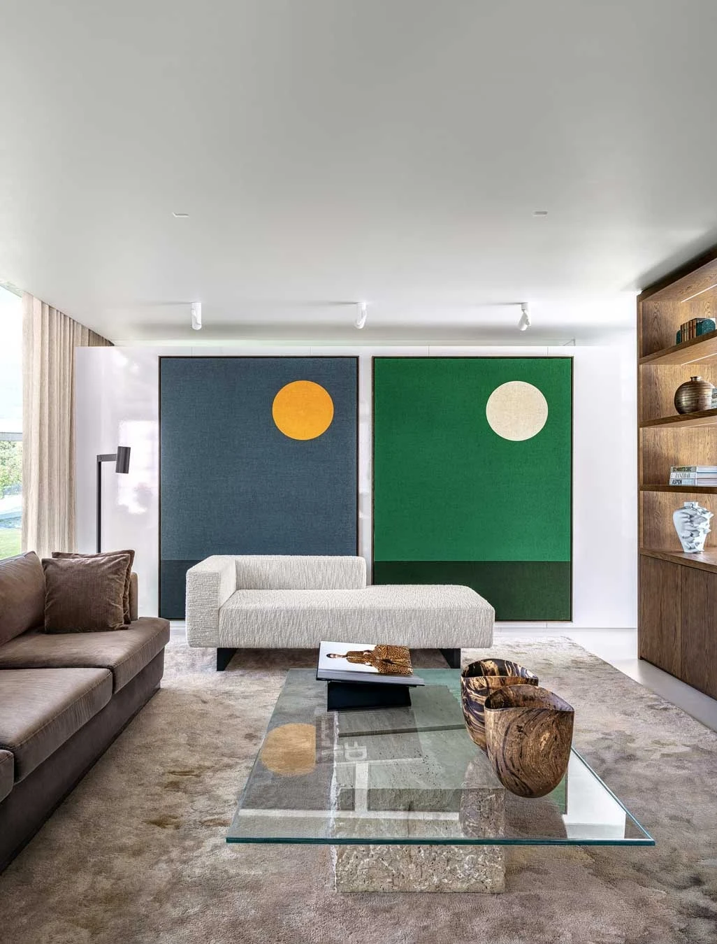 Curated furniture and art in conceptual residence.