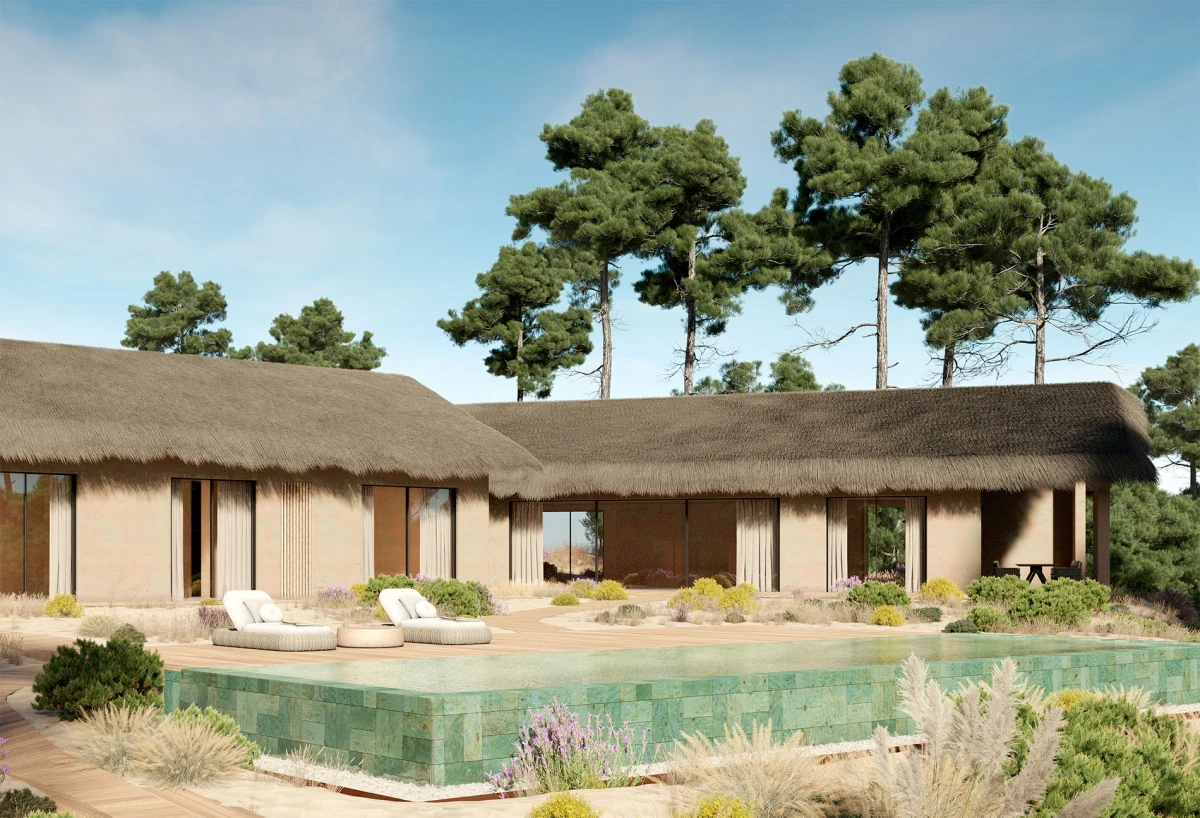 Vista exterior de casa de luxo na Comporta com arquitetura em materiais naturais e piscina em pedra verde.
