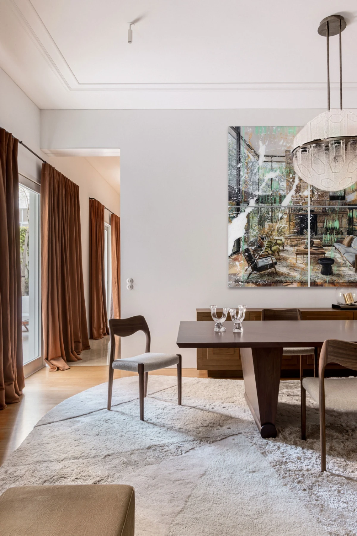 Modern dining room with table in wood and unique feet, classical danish design chairs and bespoke rug in beige designed by Cristina Jorge de Carvalho