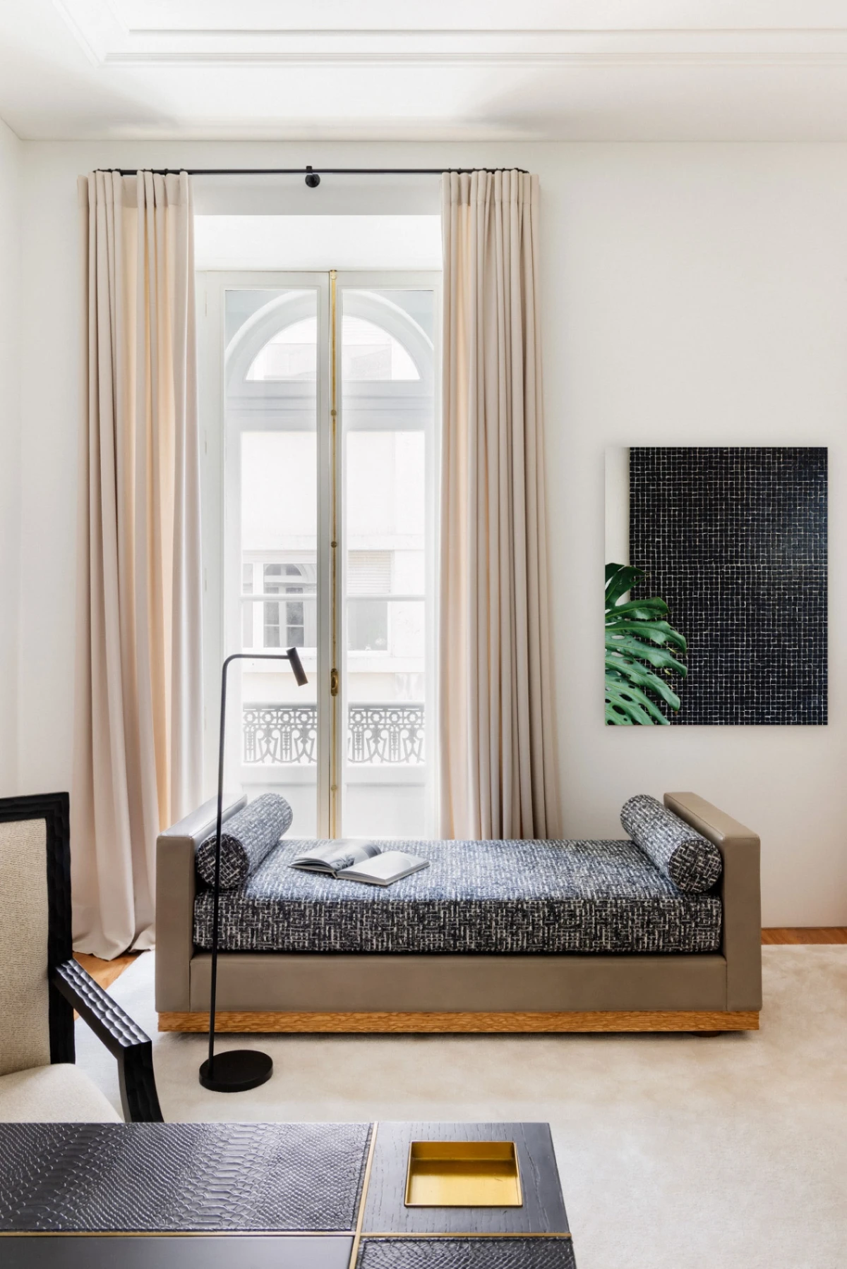 Modern living room in a classical house with a bespoke leather daybed designed by Cristina Jorge de Carvalho